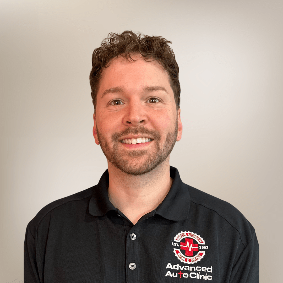Smiling man in Advanced Auto Clinic shirt.